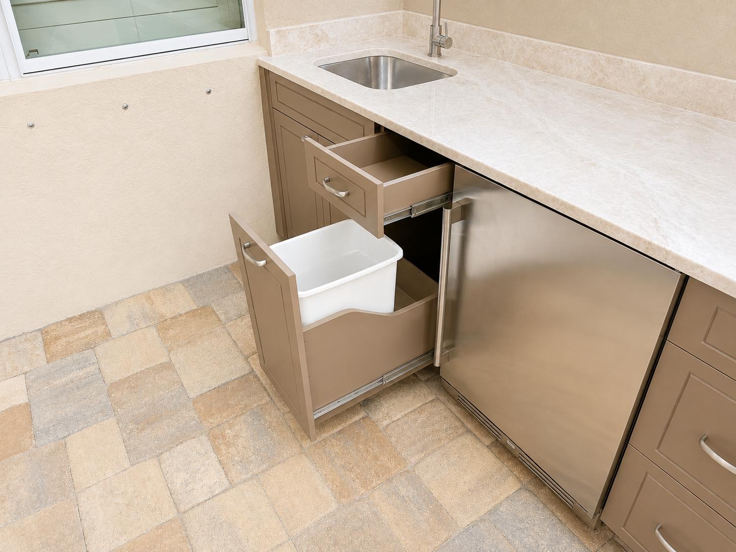 Pull-out trash cabinet in Nutmeg with Captiva door style