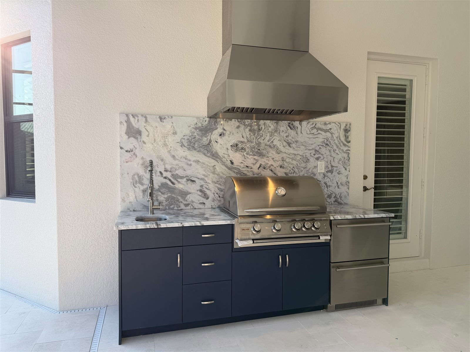 Navy line outdoor kitchen manufactured by Bespoke Cabinets and Doors