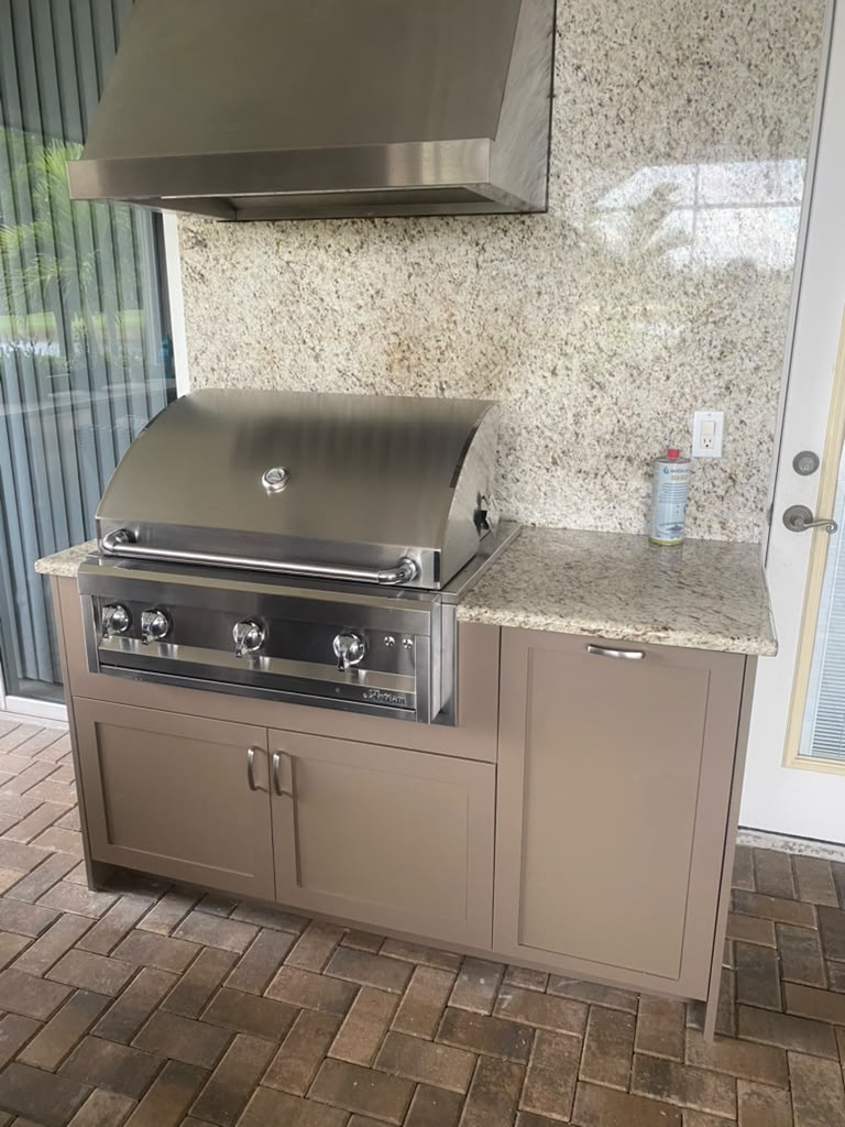 Hybrid PVC/HDPE outdoor kitchen cabinets built by Bespoke Cabinets and Doors